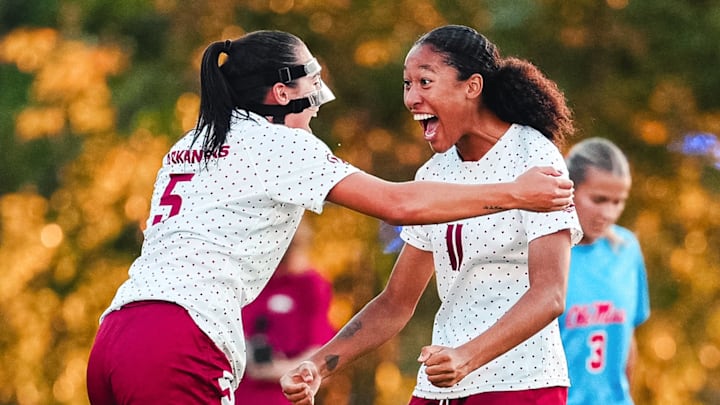 Arkansas soccer players celebrate a goal against Ole Miss. Arkansas soccer players celebrate a goal against Ole Miss.