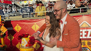 Erik Yakes marries Erin Doolan during the Cheez-It Citrus Bowl in a ceremony officiated by Cheez-It mascot Ched-Z. Image courtesy Cheez-It