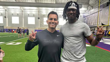 Malachi Zeigler with TCU quarterback coach Mark Cala.