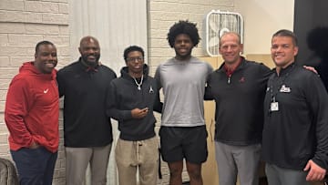 2026 DL Tyson Bacon alongside head coach Kalen DeBoer, co-offensive coordinator JaMarcus Shephard and defensive line coach Freddie Roach. 