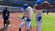 Mr. Met talks at Citi Field during a New York Mets baseball game and broadcasters Gary Cohen and Keith Hernandez are on TV