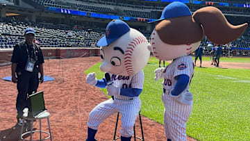 Mr. Met talks at Citi Field during a New York Mets baseball game and broadcasters Gary Cohen and Keith Hernandez are on TV