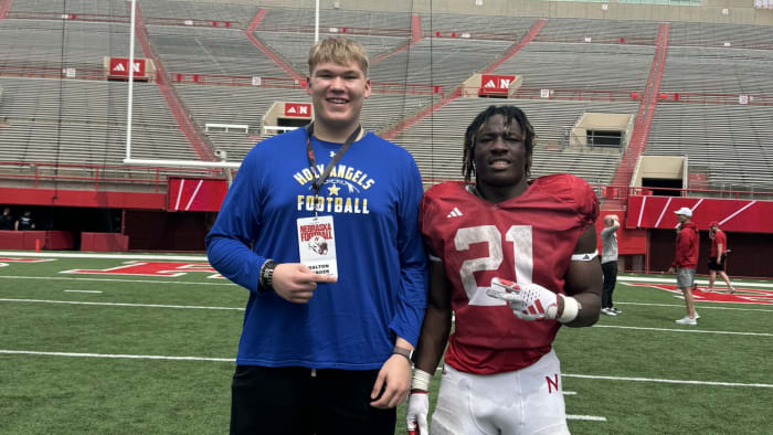 Dalton DeBoer poses with fellow Minnesotan Emmett Johnson, a Nebraska running back.