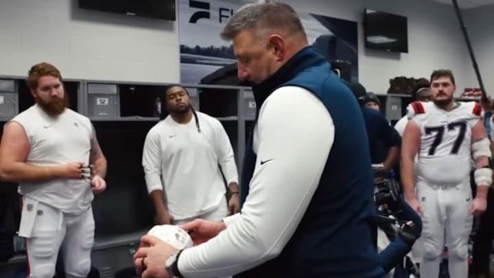 Mike Vrabel admires his craftsmanship.