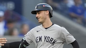 Oct 5, 2025; Toronto, Ontario, CAN; New York Yankees right fielder Aaron Judge (99) congratulates left fielder Cody Bellinger (35) after a two-run home run in the sixth inning against the Toronto Blue Jays during game two of the ALDS round for the 2025 MLB playoffs at Rogers Centre. Mandatory Credit: John E. Sokolowski-Imagn Images