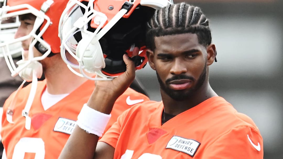 Cleveland Browns quarterback Shedeur Sanders (12) listens to a play call during minicamp at CrossCountry Mortgage Campus.
