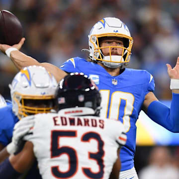 Justin Herbert throws against the Bears last season. Bears receiver Keenan Allen, a former Herbert teammate says Caleb Williams is ahead of where Herbert was at this point in his career.