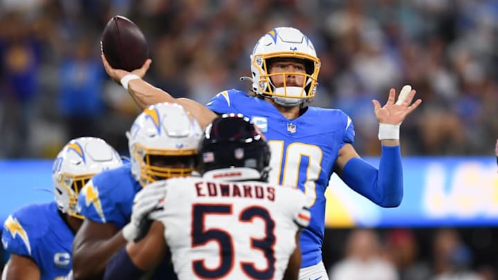 Justin Herbert throws against the Bears last season. Bears receiver Keenan Allen, a former Herbert teammate says Caleb Williams is ahead of where Herbert was at this point in his career.