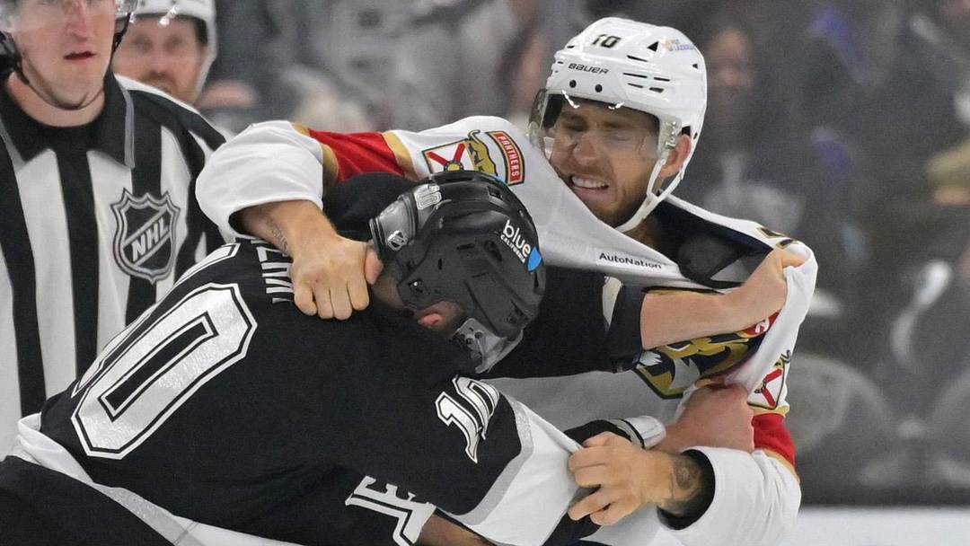 Nov 6, 2025; Los Angeles, California, USA;  Los Angeles Kings right wing Corey Perry (10) and Florida Panthers left wing A.J. Greer (10) fight during the third period at Crypto.com Arena. Mandatory Credit: Jayne Kamin-Oncea-Imagn Images