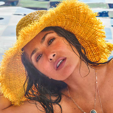 Salma Hayek Pinault was photographed by Ruven Afanador in Mexico. Hat by Alémais. 