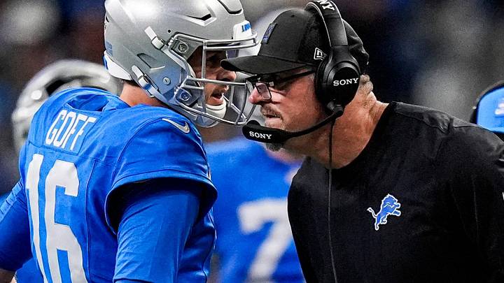 Detroit Lions quarterback Jared Goff (16) talks to head coach Dan Campbell before a play against the Green Bay Packers during the first half at Ford Field in Detroit on Thursday, Nov. 27, 2025.