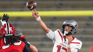 Thompson's quarterback Trent Seaborn (12) passes against Opelika during their AHSAA 7A Football State Championship game in Birmingham, Ala. on Wednesday December 3, 2025.