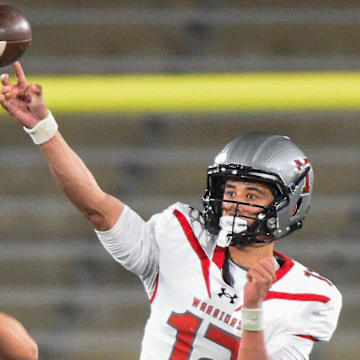 Thompson's quarterback Trent Seaborn (12) passes against Opelika during their AHSAA 7A Football State Championship game in Birmingham, Ala. on Wednesday December 3, 2025.