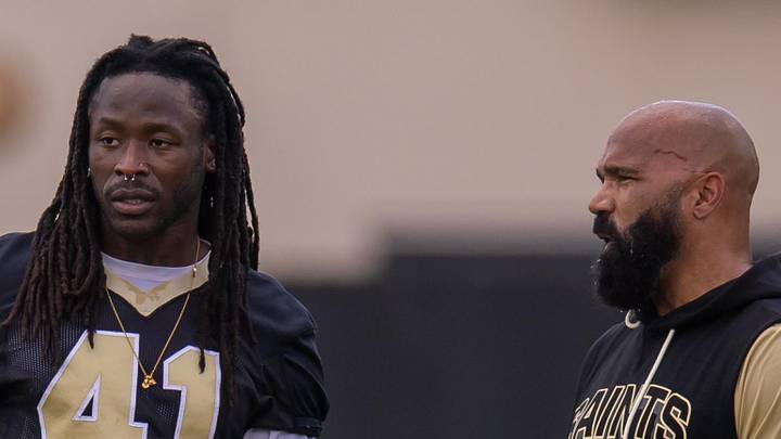 New Orleans Saints running back coach Joel Thomas talks to running back Alvin Kamara