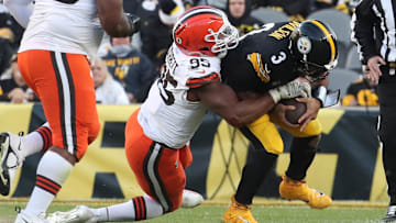 Dec 8, 2024; Pittsburgh, Pennsylvania, USA;  Cleveland Browns defensive end Myles Garrett (95) sacks Pittsburgh Steelers quarterback Russell Wilson (3) during the fourth quarter at Acrisure Stadium. Mandatory Credit: Charles LeClaire-Imagn Images