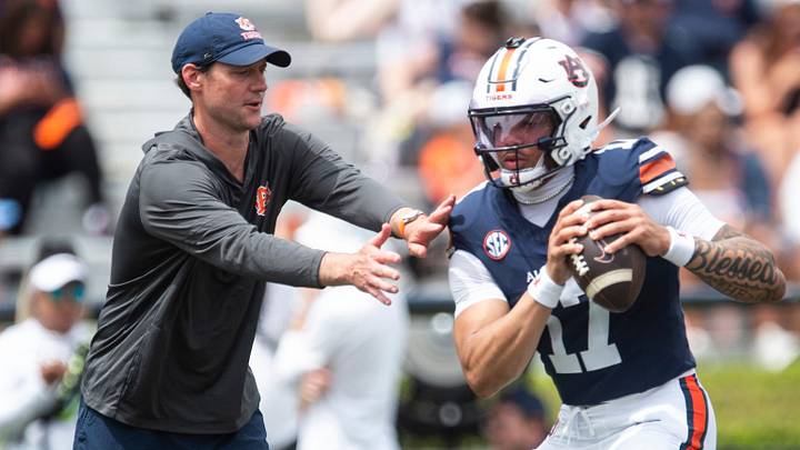 Auburn Tigers offensive coordinator Joel Gordon runs drills with Auburn Tigers quarterback Byrum Brown (17) during warm ups before Auburn Tigers A-Day spring game at Jordan-Hare Stadium in Auburn, Ala. on Saturday, April 18, 2026.