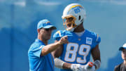 Chargers head coach Jim Harbaugh talks with tight end Donald Parham Jr., right, during the first day of training camp at The Bolt.