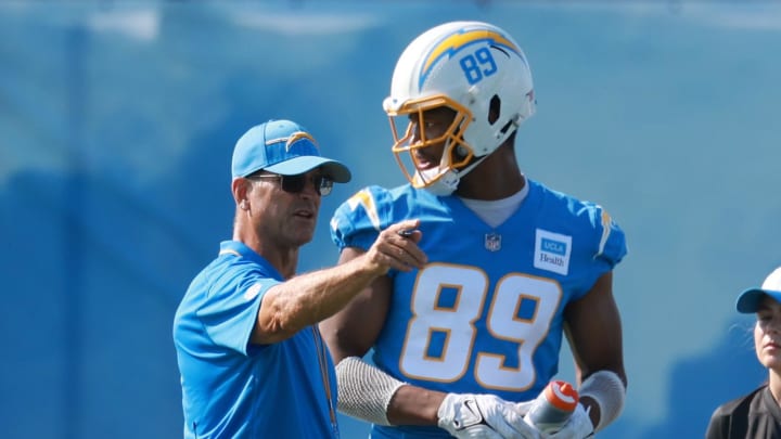 Chargers head coach Jim Harbaugh talks with tight end Donald Parham Jr., right, during the first day of training camp at The Bolt.