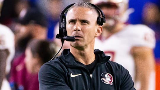 Florida State Seminoles head coach Mike Norvell looks to the replay screen at Steve Spurrier Field at Ben Hill Griffin Stadium in Gainesville, FL on Saturday, November 25, 2023 during the first half. [Doug Engle/Gainesville Sun]