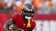 Tampa Bay Buccaneers running back Bucky Irving (7) runs with the ball against the Carolina Panthers