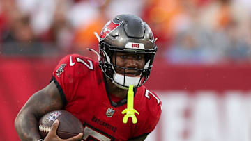 Tampa Bay Buccaneers running back Bucky Irving (7) runs with the ball against the Carolina Panthers