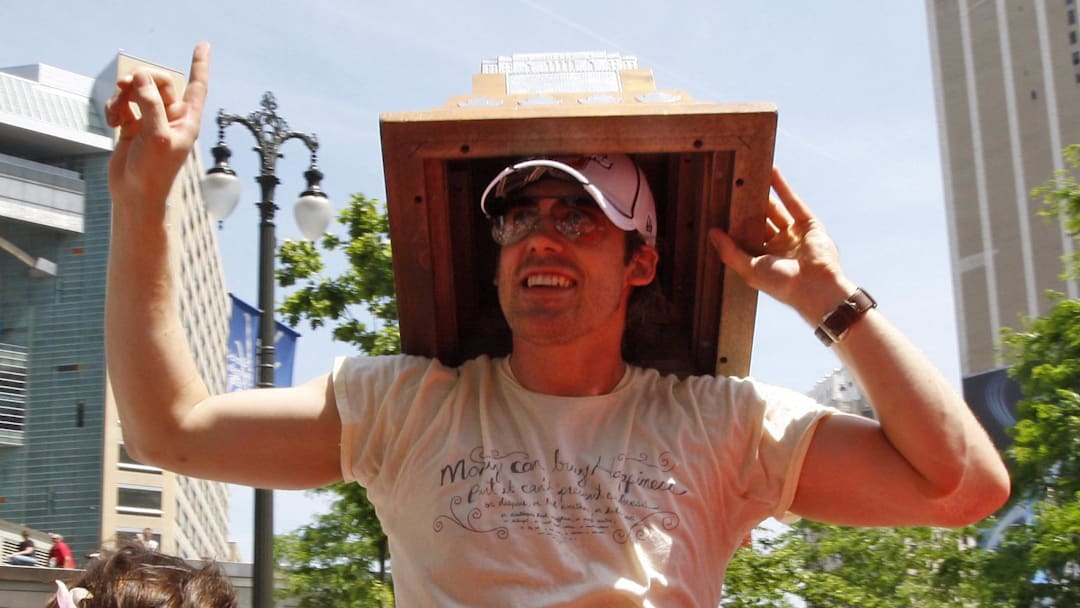 June 6, 2008; Detroit, MI, USA; Detroit Red Wings player Henrik Zetterberg (40) holds the Conn Smythe trophy for MVP honors during the Stanley Cup championship victory parade. Mandatory Credit: Leon Halip-Imagn Images