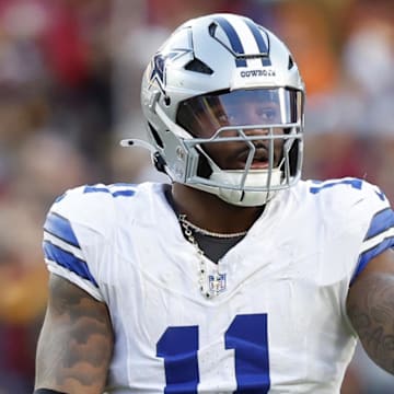 Nov 24, 2024; Landover, Maryland, USA; Dallas Cowboys linebacker Micah Parsons (11) gestures to the bench against the Washington Commanders at Northwest Stadium. Mandatory Credit: Geoff Burke-Imagn Images