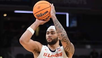 Mar 13, 2025; Indianapolis, IN, USA; Illinois Fighting Illini guard Kylan Boswell (4) shoots during the first half against the Iowa Hawkeyes at Gainbridge Fieldhouse. Mandatory Credit: Robert Goddin-Imagn Images