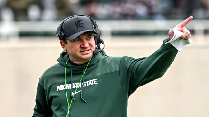 Michigan State's head coach Jonathan Smith communicates with staff on Saturday, April 20, 2024, at Spartan Stadium in East Lansing.