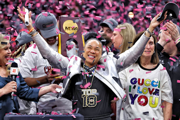Dawn Staley celebrates with confetti raining down as the South Carolina Gamecocks win the 2023-24 NCAA title.  
