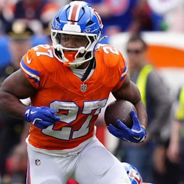 Oct 26, 2025; Denver, Colorado, USA; Denver Broncos running back J.K. Dobbins (27) runs against the Dallas Cowboys in the first half at Empower Field at Mile High. 