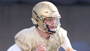 University of Akron quarterback Ryan Jankowski scrambles as he looks for a receiver during the UA football scrimmage at InfoCiision Stadium on Saturday March 27, 2021 in Akron.

Uafoot 328 13