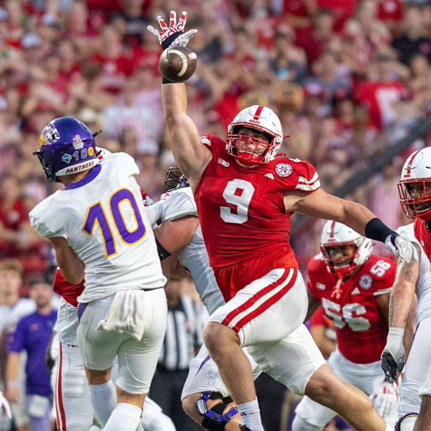 Nebraska defensive lineman Ty Robinson bats down a pass from Northern Iowa quarterback Aidan Dunne.