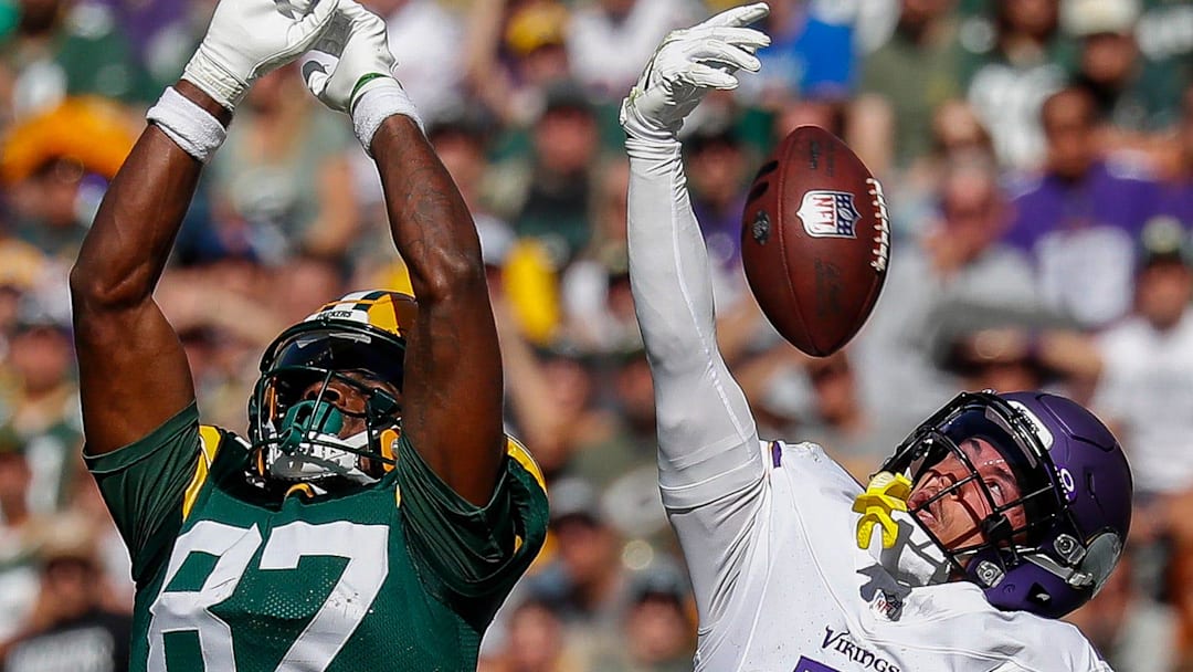 Minnesota Vikings cornerback Byron Murphy Jr. (7) breaks up a pass intended for Green Bay Packers receiver Romeo Doubs.