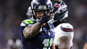 Oct 20, 2025; Seattle, Washington, USA; Seattle Seahawks wide receiver Jaxon Smith-Njigba (11) celebrates after a first down during the third quarter against the Houston Texans at Lumen Field.