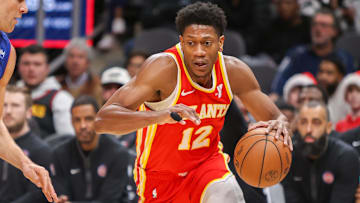 Dec 18, 2023; Atlanta, Georgia, USA; Atlanta Hawks forward De'Andre Hunter (12) drives to the basket against the Detroit Pistons in the second quarter at State Farm Arena. Mandatory Credit: Brett Davis-Imagn Images
