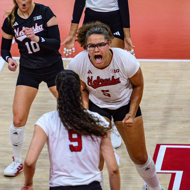 Rebekah Allick (5) celebrates a kill Virginia Adriano (9). 