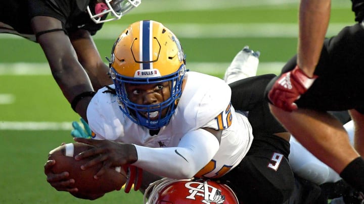 Miami Northwestern's quarterback Leon Strawder (12) has a big game last week as Miami Northwestern blitzed Coconut Creek, 45-0, in its season opener. Now the Bulls and head coach Teddy Bridgewater travel to face West Florida power Venice.