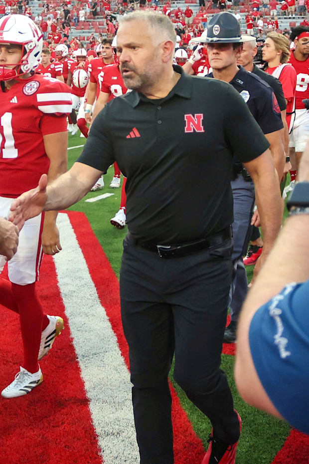 Head coaches Jonathan Smith and Matt Rhule shake hands after the 2025 Nebraska-Michigan State game in Lincoln