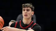 Mar 13, 2025; Charlotte, NC, USA; Stanford Cardinal forward Maxime Raynaud (42) passes the ball in the first half at Spectrum Center. Mandatory Credit: Bob Donnan-Imagn Images