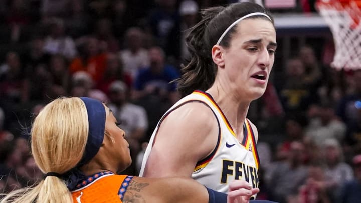 Aug 28, 2024; Indianapolis, Indiana, USA; Connecticut Sun guard DiJonai Carrington (21) guards Indiana Fever guard Caitlin Clark (22) during a game between the Indiana Fever and the Connecticut Sun at Gainbridge Fieldhouse. Mandatory Credit: Grace Smith-INDIANAPOLIS STAR-USA TODAY Sports