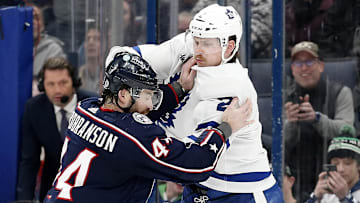 Dec 29, 2023; Columbus, Ohio, USA; Columbus Blue Jackets defenseman Erik Gudbranson (44) and Toronto Maple Leafs defenseman Simon Benoit (2) fight during the second period at Nationwide Arena. Mandatory Credit: Russell LaBounty-Imagn Images