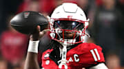 Nov 1, 2025; Raleigh, North Carolina, USA;  North Carolina State Wolfpack quarterback CJ Bailey (11) throws a pass during the first quarter against the Georgia Tech Yellow Jackets at Carter-Finley Stadium. Mandatory Credit: Zachary Taft-Imagn Images