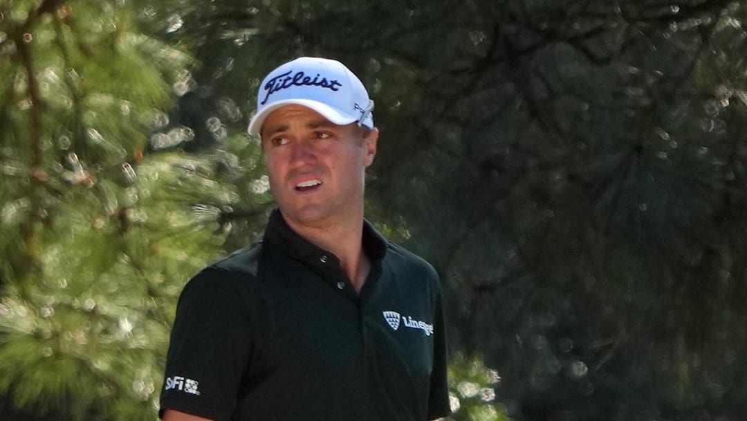 Justin Thomas reacts after a shot from a bunker on the first hole during the second round of the 2026 Masters Tournament