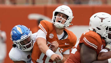 Texas Longhorns quarterback Arch Manning reacts after getting hit by San Jose State Spartans linebacker Taniela Latu during the second half at Darrell K Royal-Texas Memorial Stadium.