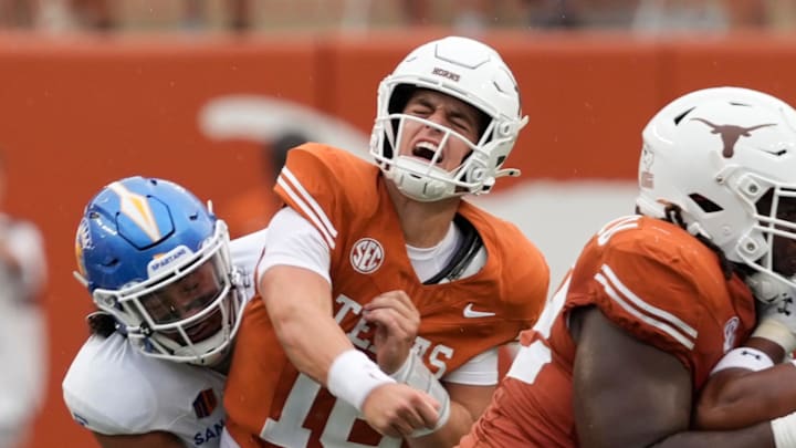 Texas Longhorns quarterback Arch Manning reacts after getting hit by San Jose State Spartans linebacker Taniela Latu during the second half at Darrell K Royal-Texas Memorial Stadium.