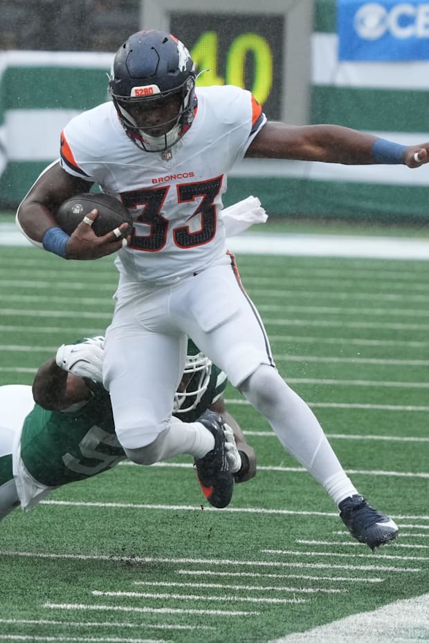 Javonte Williams of Denver runs the ball in the first half as the Denver Broncos edged the New York Jet