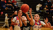 Sauk Rapids girls basketball sophomore Brooklyn Widmer and St. Cloud Crush junior Weslie Schuck go after a loose ball during a game Dec. 6, 2024 at Sauk Rapids High School. The Storm lost 70-51.