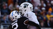 Nov 1, 2025; Minneapolis, Minnesota, USA; Michigan State Spartans running back Brandon Tullis (7) runs the ball for a touchdown against the Minnesota Golden Gophers during the second half at Huntington Bank Stadium. Mandatory Credit: Matt Krohn-Imagn Images