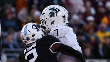 Nov 1, 2025; Minneapolis, Minnesota, USA; Michigan State Spartans running back Brandon Tullis (7) runs the ball for a touchdown against the Minnesota Golden Gophers during the second half at Huntington Bank Stadium. Mandatory Credit: Matt Krohn-Imagn Images